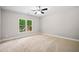 Bedroom featuring neutral walls, plush carpeting, one window overlooking the exterior at 217 Heritage Town Pkwy, Canton, GA 30115