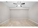 Bedroom featuring neutral walls, plush carpeting, ample lighting, and ceiling fan at 217 Heritage Town Pkwy, Canton, GA 30115