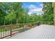Large deck overlooking a swimming pool and wooded backyard at 217 Heritage Town Pkwy, Canton, GA 30115