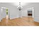 Elegant dining area with hardwood floors and a decorative chandelier at 217 Heritage Town Pkwy, Canton, GA 30115