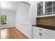 Bright dining room with hardwood floors, natural lighting and built-in cabinets at 217 Heritage Town Pkwy, Canton, GA 30115