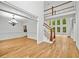Bright foyer with hardwood floors, chandelier, and a view of the staircase at 217 Heritage Town Pkwy, Canton, GA 30115