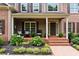 Charming front porch features decorative seating and a brick walkway at 217 Heritage Town Pkwy, Canton, GA 30115
