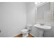 Stylish half bathroom featuring a pedestal sink and modern fixtures at 217 Heritage Town Pkwy, Canton, GA 30115