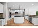 Modern kitchen with granite countertops, stainless steel appliances, and hardwood floors at 217 Heritage Town Pkwy, Canton, GA 30115