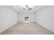 Spacious living room with neutral carpet and an open doorway leading into the kitchen at 217 Heritage Town Pkwy, Canton, GA 30115