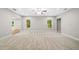 Bright living room featuring neutral walls, plush carpeting, and multiple windows at 217 Heritage Town Pkwy, Canton, GA 30115