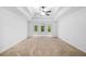 Expansive main bedroom with neutral carpet and ample natural light from three windows at 217 Heritage Town Pkwy, Canton, GA 30115