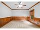 Spacious office with wood paneled walls and a large window at 217 Heritage Town Pkwy, Canton, GA 30115