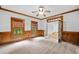 Charming office with wood trim, paneled walls, carpet, and windows with views of the landscaped yard at 217 Heritage Town Pkwy, Canton, GA 30115