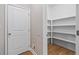 Walk-in pantry with ample shelving, providing excellent storage solutions at 217 Heritage Town Pkwy, Canton, GA 30115
