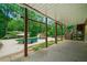 Back patio offers a shady spot to enjoy the pool and wooded views at 217 Heritage Town Pkwy, Canton, GA 30115