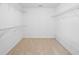 Spacious walk-in closet with carpet flooring and wire shelving for optimal storage at 217 Heritage Town Pkwy, Canton, GA 30115