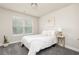 Bedroom featuring cozy carpet, a window with blinds, and white comforter at 3302 Bellingham Way, Lithia Springs, GA 30122