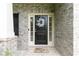 Close-up of the front door, featuring a welcoming wreath at 3302 Bellingham Way, Lithia Springs, GA 30122