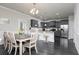 Eat-in kitchen with stainless steel appliances, dark cabinets, and a center island at 3302 Bellingham Way, Lithia Springs, GA 30122