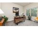 Inviting office with modern desk, office chair, natural light, and decorative greenery at 3302 Bellingham Way, Lithia Springs, GA 30122