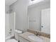 Bathroom with granite counters, toilet, shower and white cabinets at 341 Windermere Dr., Loganville, GA 30052