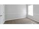 This bedroom offers plush carpeting and natural light, creating a cozy and inviting space at 341 Windermere Dr., Loganville, GA 30052