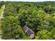 Aerial view of the house surrounded by mature trees and green landscape at 133 Sw Patterson Rd, Lawrenceville, GA 30044