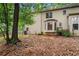 View of the backyard with an exterior building, yard, and trees at 133 Sw Patterson Rd, Lawrenceville, GA 30044