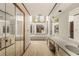 Bright bathroom with double sinks, large tub, and plenty of mirrored storage at 133 Sw Patterson Rd, Lawrenceville, GA 30044