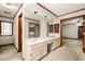 Large primary bathroom with double sink vanity and multiple entry points at 133 Sw Patterson Rd, Lawrenceville, GA 30044