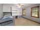 Bedroom with built in shelving and cabinets and two windows at 133 Sw Patterson Rd, Lawrenceville, GA 30044