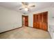 Cozy bedroom features neutral walls, ceiling fan, and built-in closet space at 133 Sw Patterson Rd, Lawrenceville, GA 30044