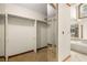 Large walk-in closet with custom shelving and access to bathroom at 133 Sw Patterson Rd, Lawrenceville, GA 30044