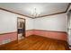 Traditional dining room with hardwood floors and classic chandelier at 133 Sw Patterson Rd, Lawrenceville, GA 30044