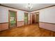 Formal dining room with hardwood floors, decorative wood trim, and an elegant chandelier at 133 Sw Patterson Rd, Lawrenceville, GA 30044