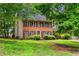A two-story brick home, lawn, and front sidewalk at 133 Sw Patterson Rd, Lawrenceville, GA 30044