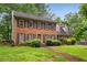 Charming two-story brick home with manicured lawn and inviting entryway at 133 Sw Patterson Rd, Lawrenceville, GA 30044