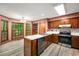 Eat-in kitchen with stainless steel appliances, white counter tops and wood cabinets at 133 Sw Patterson Rd, Lawrenceville, GA 30044