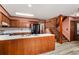 Open kitchen with wooden cabinetry, light countertops, and center island at 133 Sw Patterson Rd, Lawrenceville, GA 30044