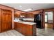 Traditional kitchen featuring wood cabinets, an island, and modern appliances at 133 Sw Patterson Rd, Lawrenceville, GA 30044