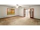 Spacious main bedroom with a ceiling fan, natural lighting, and access to the main bathroom at 133 Sw Patterson Rd, Lawrenceville, GA 30044