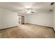 Large main bedroom featuring a ceiling fan, carpet floors and ensuite bathroom access at 133 Sw Patterson Rd, Lawrenceville, GA 30044