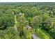 Aerial view showcasing the home's location in a neighborhood with mature trees and well-maintained properties at 1991 Flat Shoals Rd, Riverdale, GA 30296