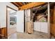 Unfinished basement with exposed pipes and a laundry area including a washer and dryer at 1991 Flat Shoals Rd, Riverdale, GA 30296