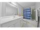 Bathroom with a large vanity, mirror, and a shower/tub combo at 1991 Flat Shoals Rd, Riverdale, GA 30296