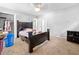 Bedroom with a dark wood bed frame, neutral carpet, closet, and gray walls at 1991 Flat Shoals Rd, Riverdale, GA 30296
