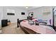 Bedroom featuring two windows, dresser, television and a bed at 1991 Flat Shoals Rd, Riverdale, GA 30296