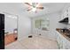 Eat-in kitchen features tile floors, neutral walls, a ceiling fan, and white cabinets at 1991 Flat Shoals Rd, Riverdale, GA 30296