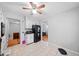 Eat-in kitchen with tile floors, and white cabinets, seamlessly connects to living spaces at 1991 Flat Shoals Rd, Riverdale, GA 30296