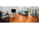 Spacious living room with hardwood floors and a large window, perfect for relaxing or entertaining guests at 1991 Flat Shoals Rd, Riverdale, GA 30296