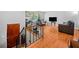 View of the living room and stairs to the lower level featuring hardwood floors and neutral paint at 1991 Flat Shoals Rd, Riverdale, GA 30296