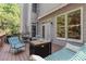 Cozy back deck featuring outdoor seating, a stylish fire pit, and views of the serene backyard at 3698 Lakeview Drive, Tucker, GA 30084