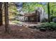 Expansive backyard with a multi-level deck, screen porch, and landscaped water feature at 3698 Lakeview Drive, Tucker, GA 30084